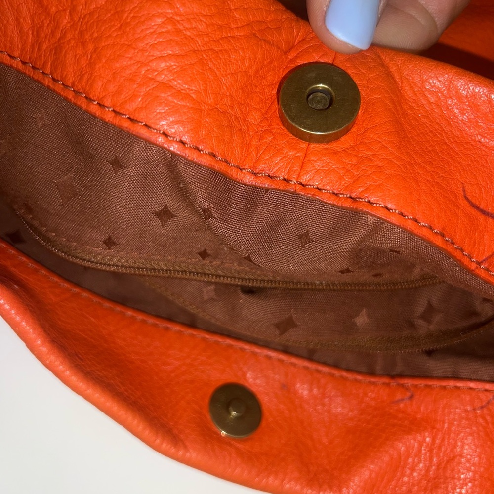 Beautiful Fossil orange and tan leather tote.